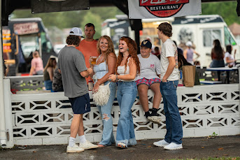 Group of people enjoying the Ashville Food Truck Festival