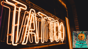 Image of orange neon sign saying "Tattoo" and the stained pumpkin tattoo convention logo in the corner.