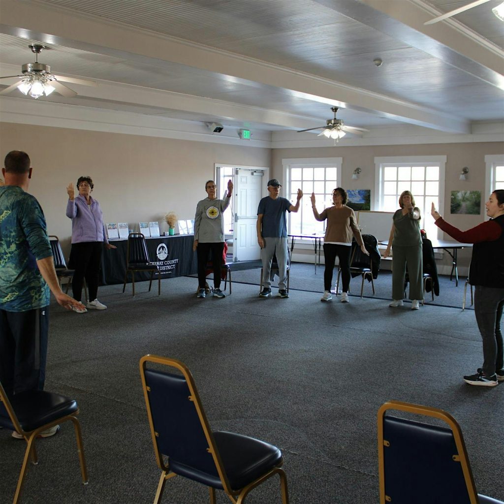 Group of adults in a tai chi or exercise class at a Pickaway County District community room