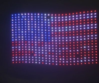 Images og drone lights how in sky with American Flag
