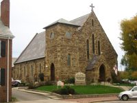 Exterior of a stone church building, similar to Circleville Presbyterian Church, the concert venue