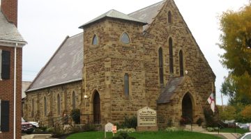 Exterior of a stone church building, similar to Circleville Presbyterian Church, the concert venue